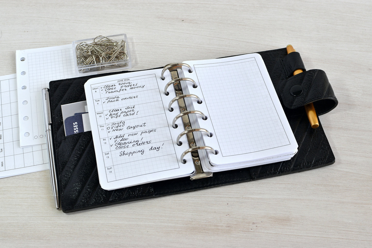 Ring pocket planner with inserts, showed on the desk