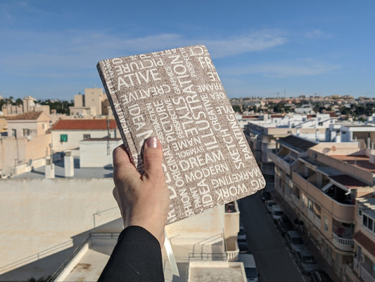 Fabric notebook and blue sky