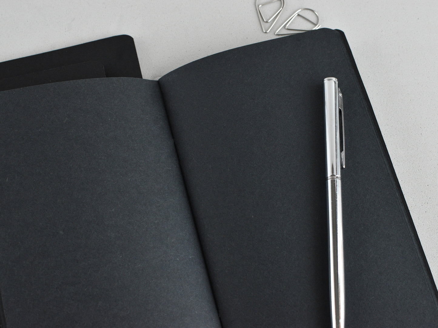 Black paper and white pen