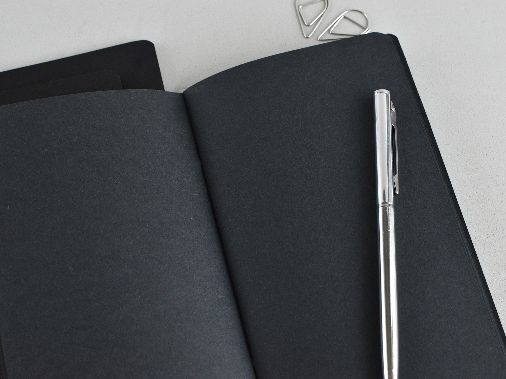 Black paper and white pen