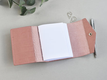 Pink leather notebook with a lank pages