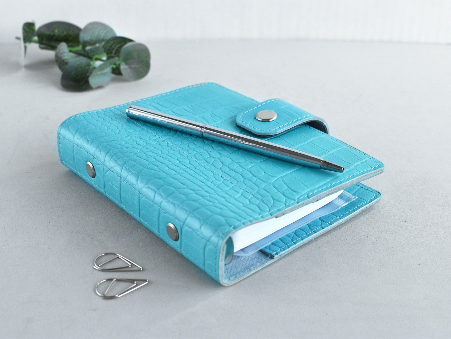 Blue leather pocket planner on my desk