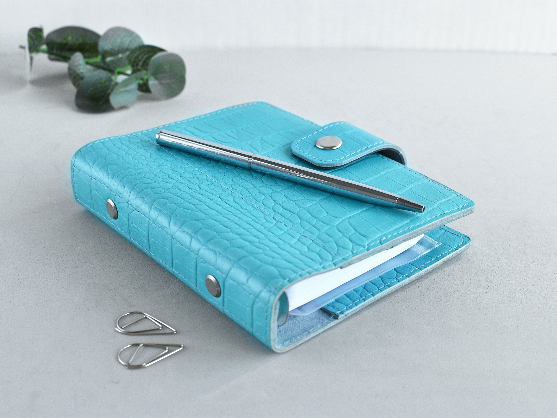 Blue leather pocket planner on my desk