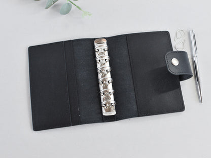 Black leather 6-ring binder, Pocket size A7. Refillable planner notebook