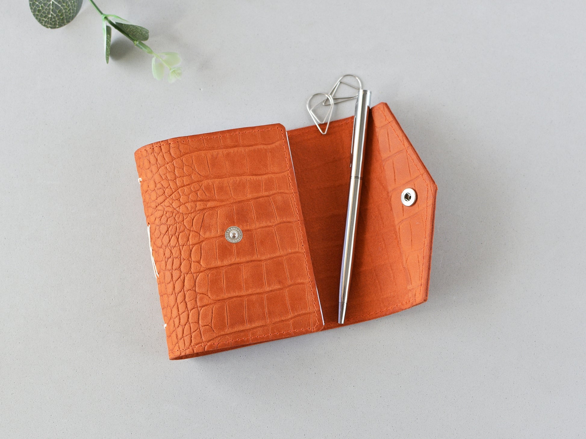Opened leather journal, snap closure
