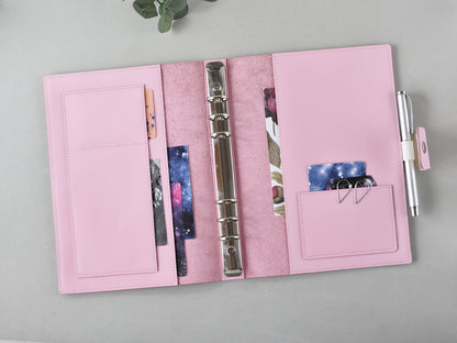 Opened A5 ring agenda cover with accessories