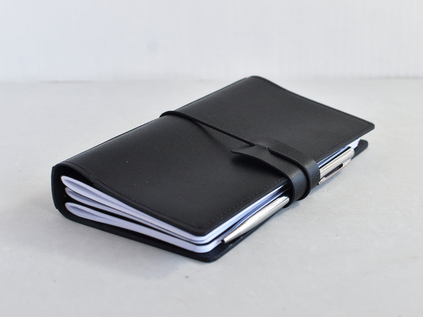 Leather travel journal with pen protector