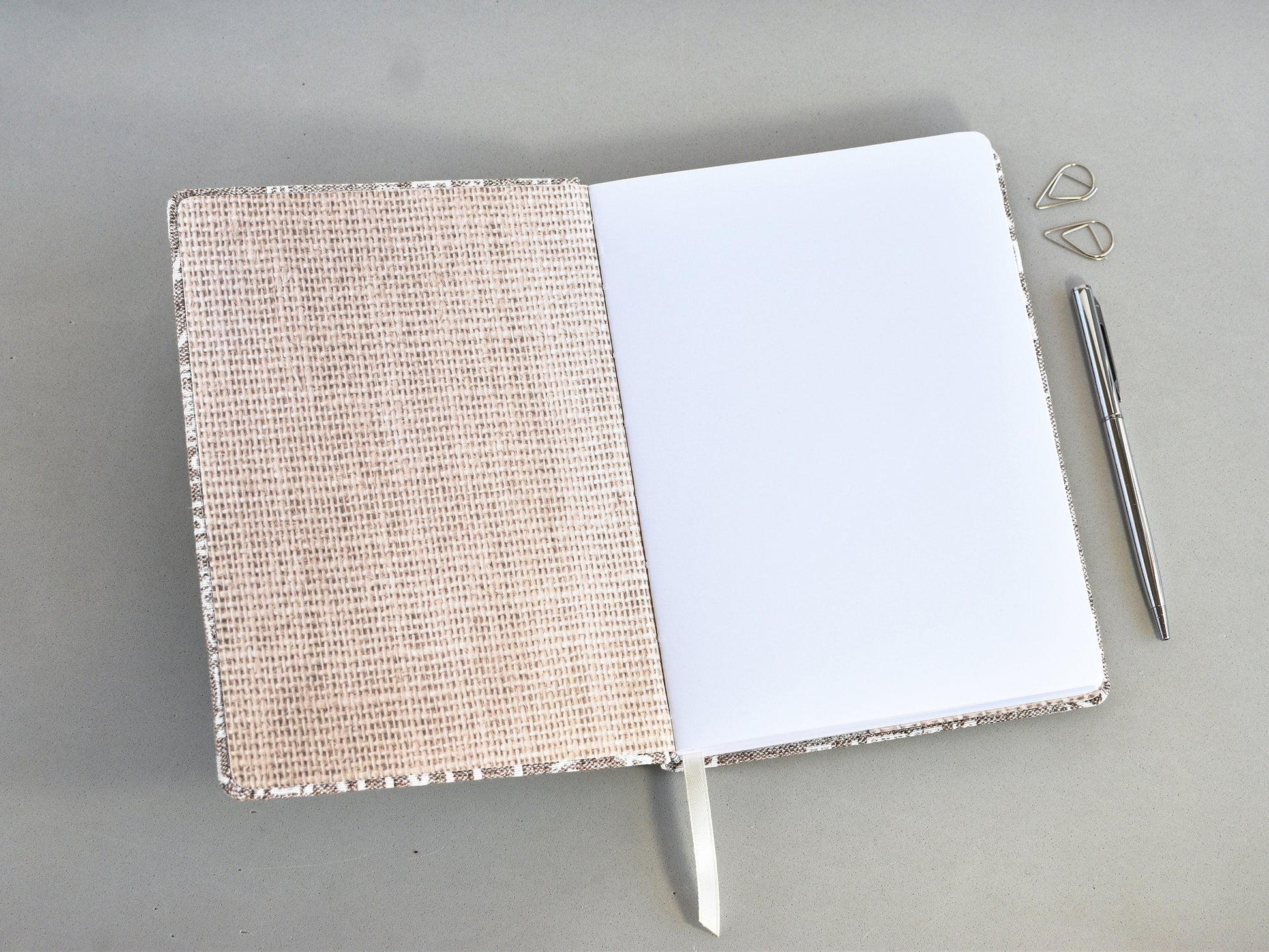 Opened notebook A5 size with a blank paes
