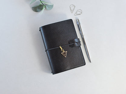Black faux leather travel journal
