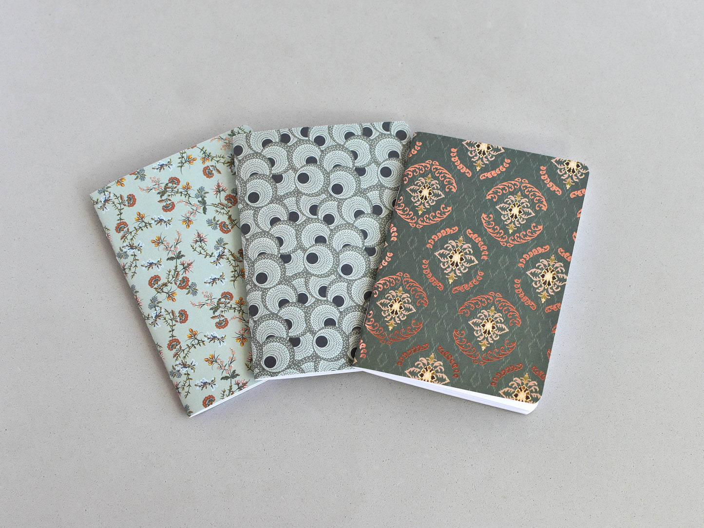 Travel journal inserts, Passport size. Three notebooks with a patterned covers