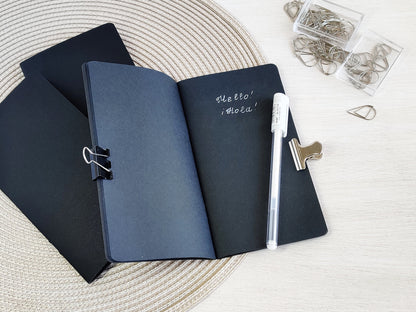 White pen and black paper